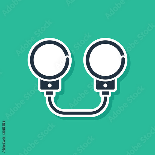 Blue Handcuffs icon isolated on green background. Vector Illustration