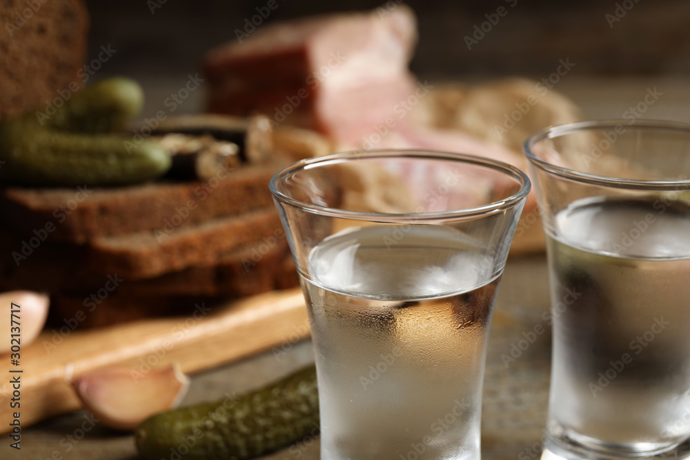 Cold traditional Russian vodka on table, closeup view Cold traditional Russian vodka on table, closeup view