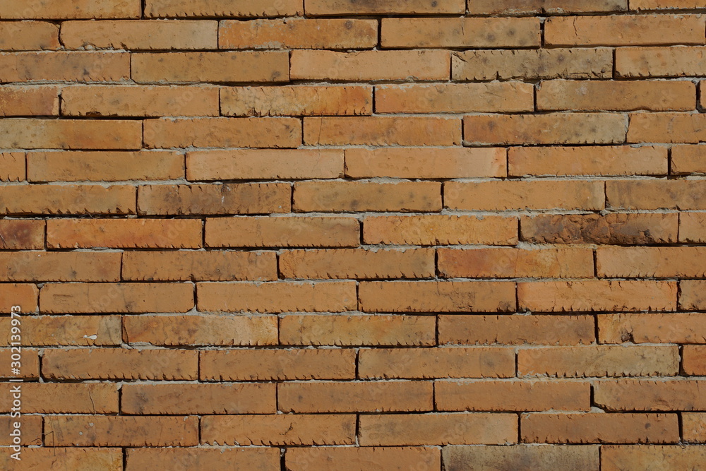 Fototapeta premium Brown clay brick wall
