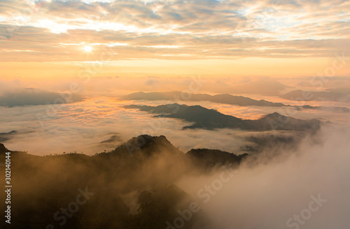 Colorful color sky with sea of mist and cloud and silhouette mountains at dawn time before sunrise, take photo from top of mountain in Thailand
