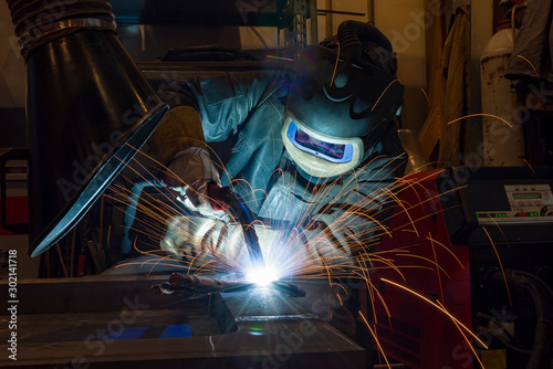 Industrial steel welder in factory welder, craftsman