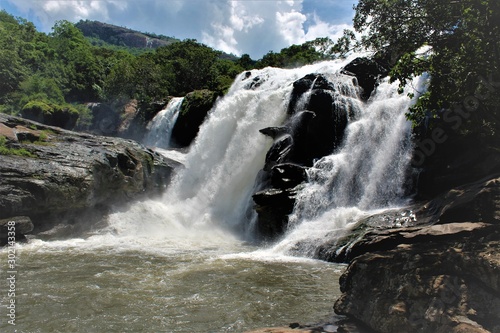 waterfall in mountains (Thoovanam) photo