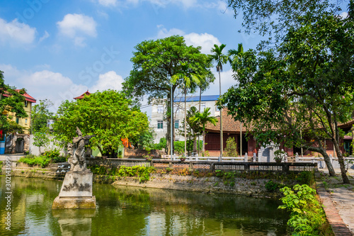 Statue of general Cao Lo at Cao Lo shrine in ancient Co Loa citadel, Vietnam. Co Loa was capital of Au Lac, the country was founded by Thuc Phan (An Duong Vuong) about 2nd century BC.  photo