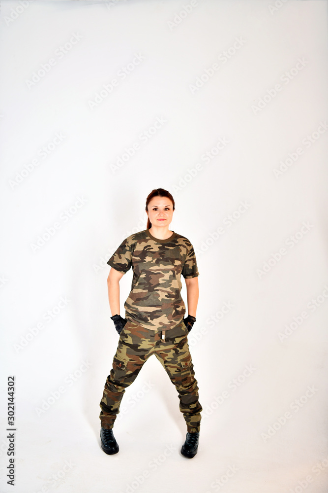 girl with red hair in a military uniform and black gloves poses in various poses girl with red hair in a military uniform and black gloves poses in various poses