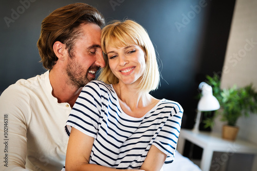 Couple in love hugging and bonding with true emotions at home