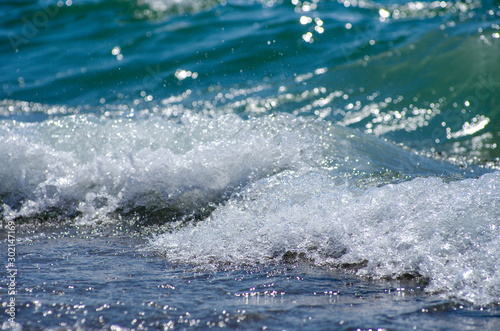 Fototapeta Naklejka Na Ścianę i Meble -  Soft wave of sea on sandy beach. Background.