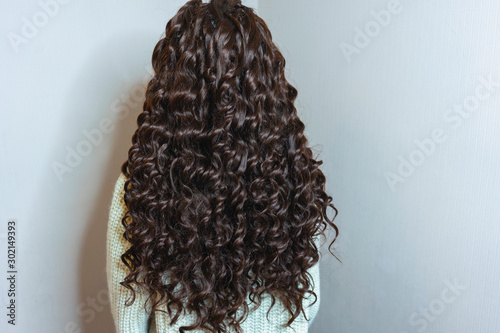 hair weaving, photo of a girl, the result of the work of a beauty salon before and after, afro curls photo