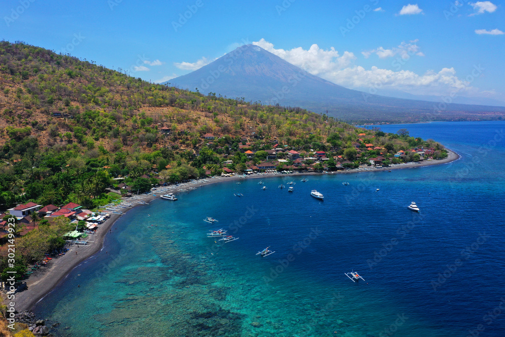 View of the island, beautiful view of Amed Beach and Mount Agung, East Coast of Bali.