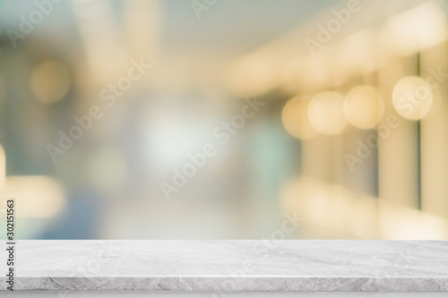 Empty white marble stone table top and blur glass window interior restaurant banner mock up abstract background - can used for display or montage your products.