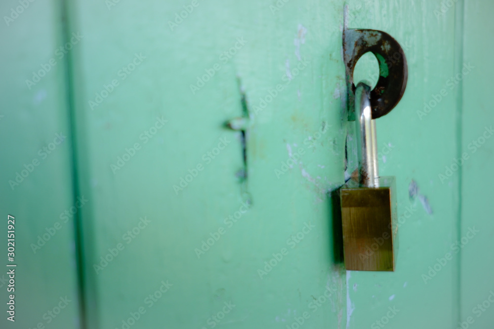 old padlock on a door old padlock on a door