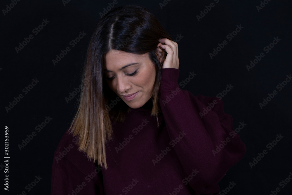 Woman touching her hair Woman touching her hair