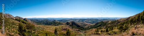 A panoramic of the inside the Maragua Crater, this landscape is beautifully coloured with a variety of minerals spread across its unique formations and spotted with dinosaur footprints and fossils. © Hal Photography