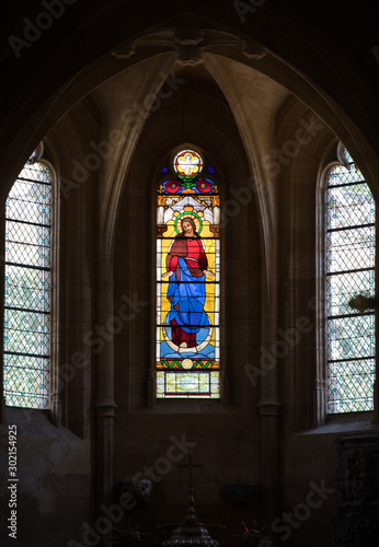 Colorful Stained Glass in medieval Sarlat Cathedral  dedicated to Saint Sacerdos. Sarlat la Caneda in Dordogne Department  Aquitaine  France