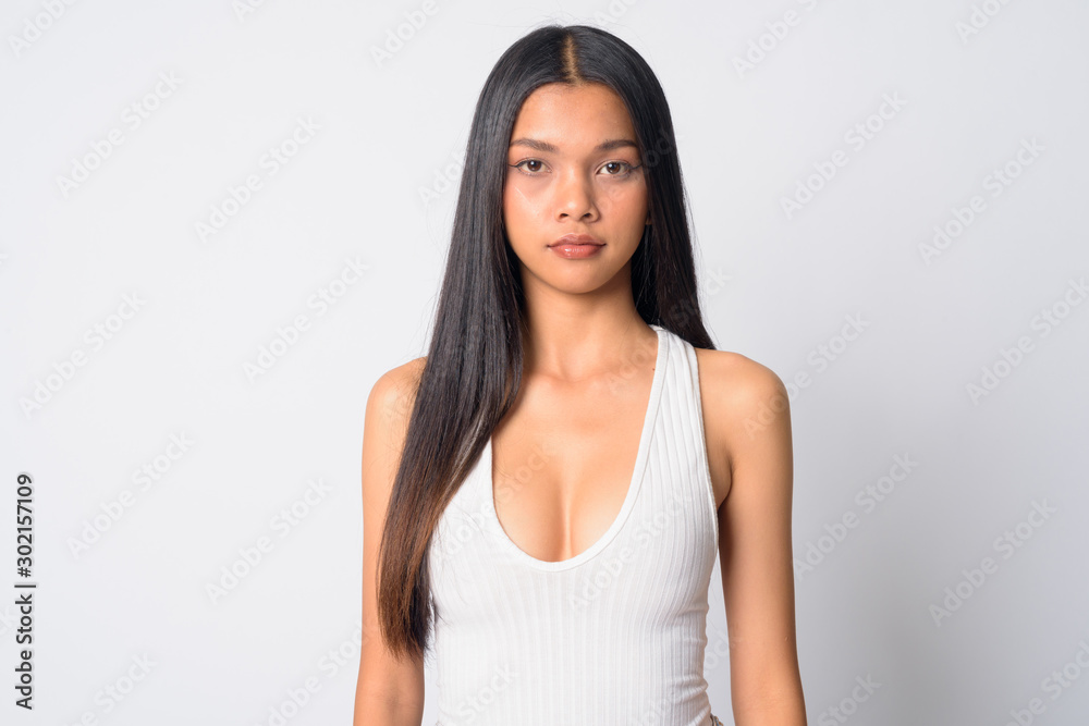 Portrait of young beautiful Asian woman looking at camera Portrait of young beautiful Asian woman looking at camera