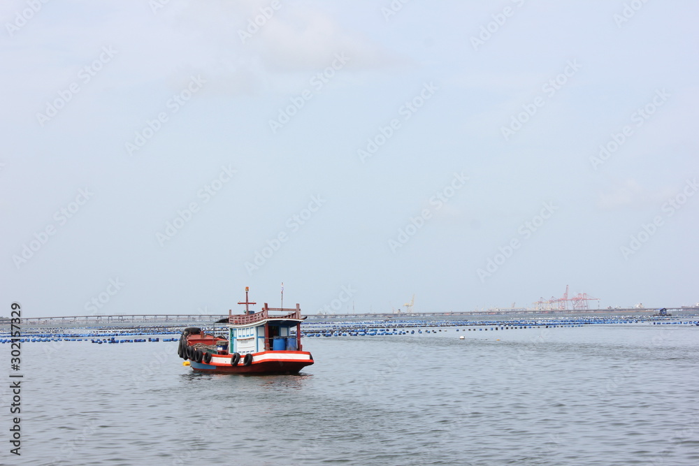 fishing boat in the sea and clear blue sky fishing boat in the sea and clear blue sky