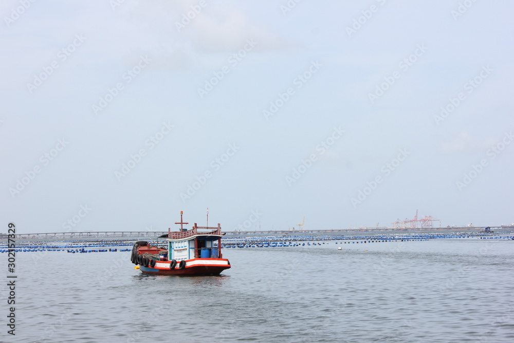 fishing boat in the sea and clear blue sky