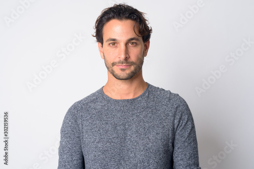 Face of handsome Hispanic man looking at camera