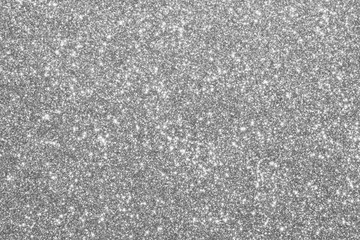 Abstract silver glitter sparkle defocused light background