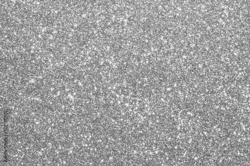 Abstract silver glitter sparkle defocused light background photo