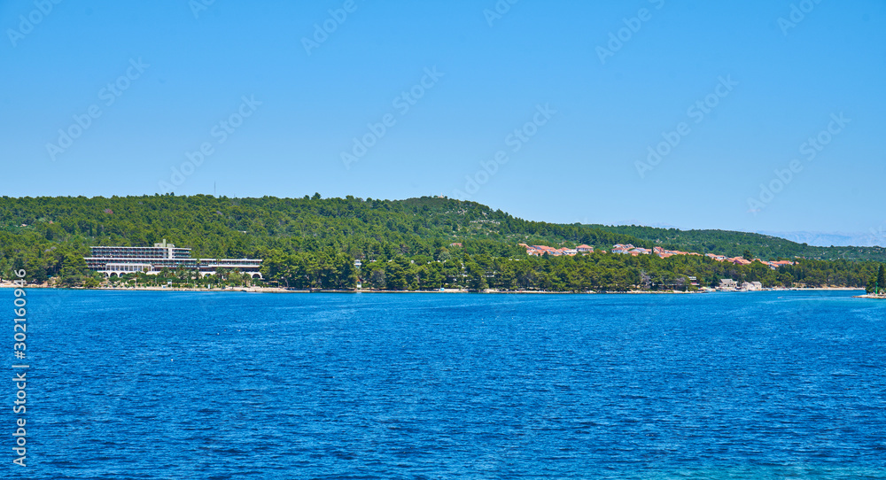 Beaches of Hvar, Croatia; turquoise waters, green pine trees and rocks                               