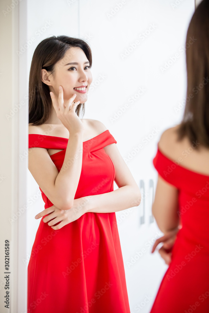 asian girl trying dress happily asian girl trying dress happily