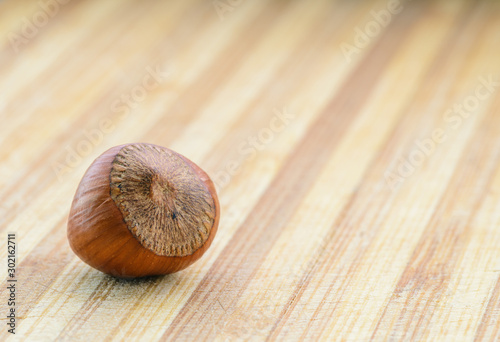 Hazelnuts on a wooden background. Selective focus with shallow depth of field.