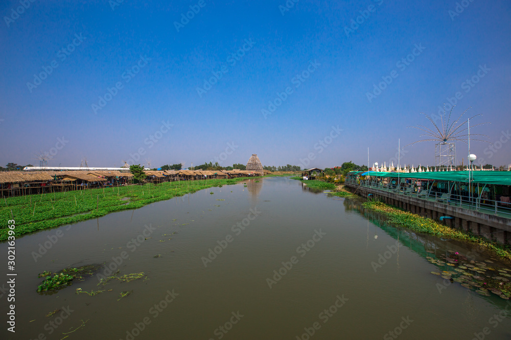 Saphan Khong Floating Market - SuphanBuri:10 November2019,River side attractions(giant fish randomly,bamboo bridge)There are tourists visiting to see the food,eat while onholiday,SongPhiNong,thailand