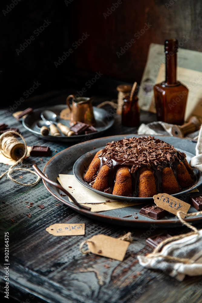 homemade chocolate cake with melted chocolate and chocolate flakes homemade chocolate cake with melted chocolate and chocolate flakes