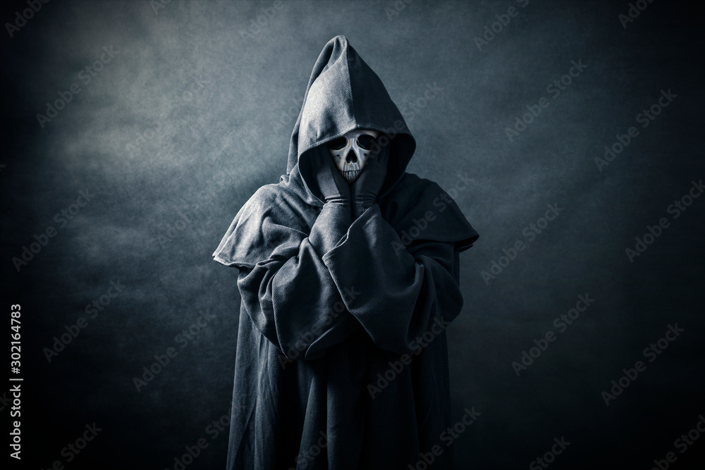 Ghostly figure in hooded cloak Ghostly figure in hooded cloak