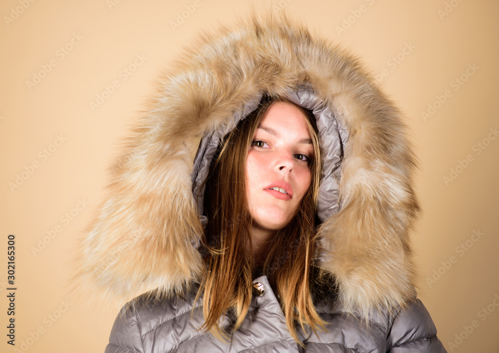 getting away from it all. beauty in winter clothing. cold season shopping. happy winter holidays. girl in puffed coat. faux fur fashion. flu and cold. seasonal fashion. woman in padded warm coat getting away from it all. beauty in winter clothing. cold season shopping. happy winter holidays. girl in puffed coat. faux fur fashion. flu and cold. seasonal fashion. woman in padded warm coat