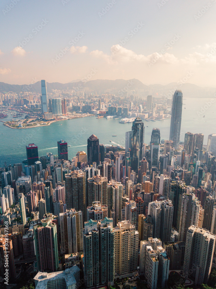 Aerial view of Hong Kong skyline under the sunlight.
