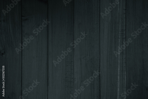 texture wood old grain texture, black dark wall background, top view of wooden table. background in vintage retro color Matte black.