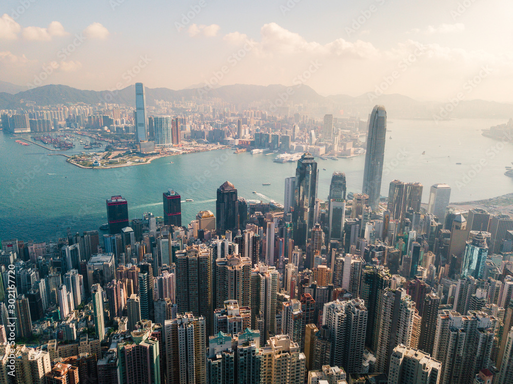 Aerial view of Hong Kong skyline under the sunlight.