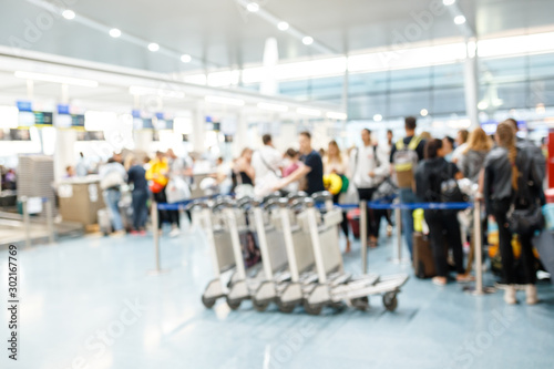 People in airport terminal,blurred background
