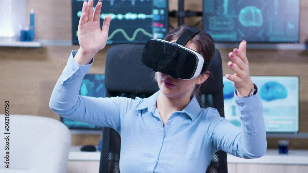 Female scientist using virtual reality goggles in a neurology clinic Female scientist using virtual reality goggles in a neurology clinic