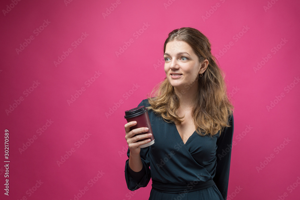 Glamor woman with a drink of coffee on a pink background	