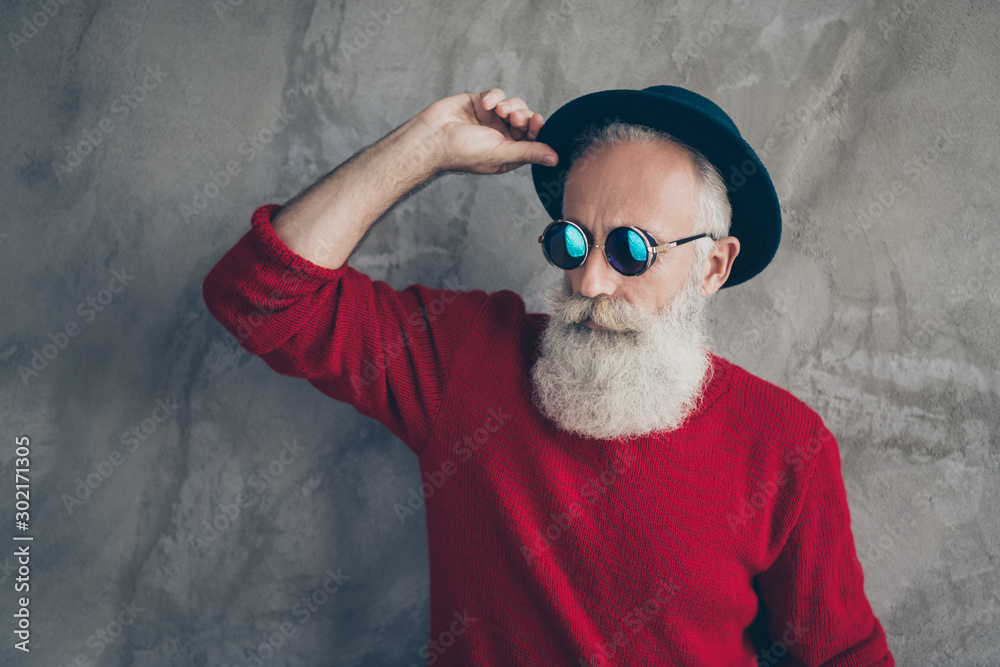 Portrait of serious brutal white hair old man look gorgeous touch his blue  hat dream christmas x-mas party celebration wear modern sweater isolated  over grey color background Stock Photo | Adobe Stock