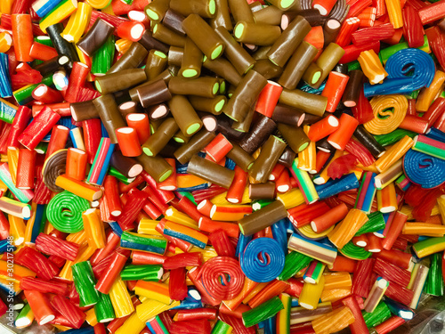 Abstract background of mixed marmalade. A lot of multi-colored chewing sweets, top view