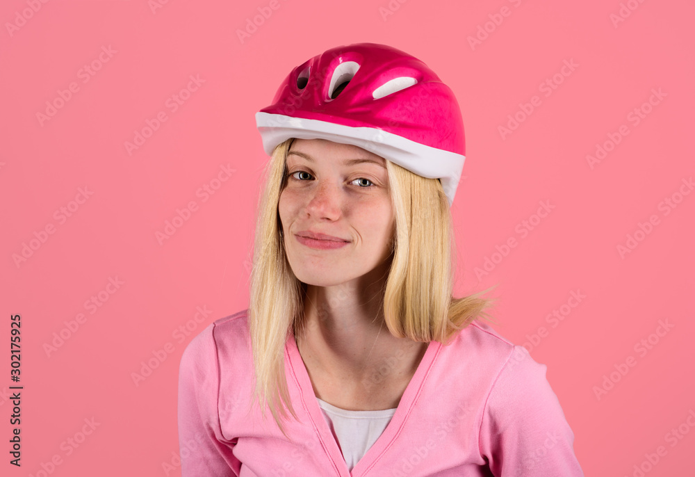 Pretty cycling girl in biking helmet. Sport lifestyle. Safety concept. Young beautiful woman wearing cyclist helmet. Biker woman in bicycle helmet. Female cyclist. Sportswoman in protective helmet.