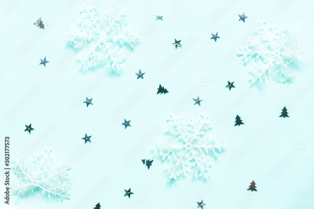 Fototapeta premium Christmas flat lay background. Gold glitter and festive decor on neo mint background. Christmas festive background.