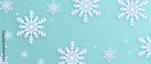 Paper art made snowflakes on blue background. Digital craft paper cut style.