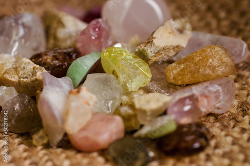 Various semi precious stones gems close up with crystals