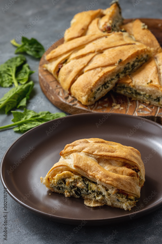 Homemade savory braided puff pastry with spinach and ricotta filling. Homemade savory braided puff pastry with spinach and ricotta filling.