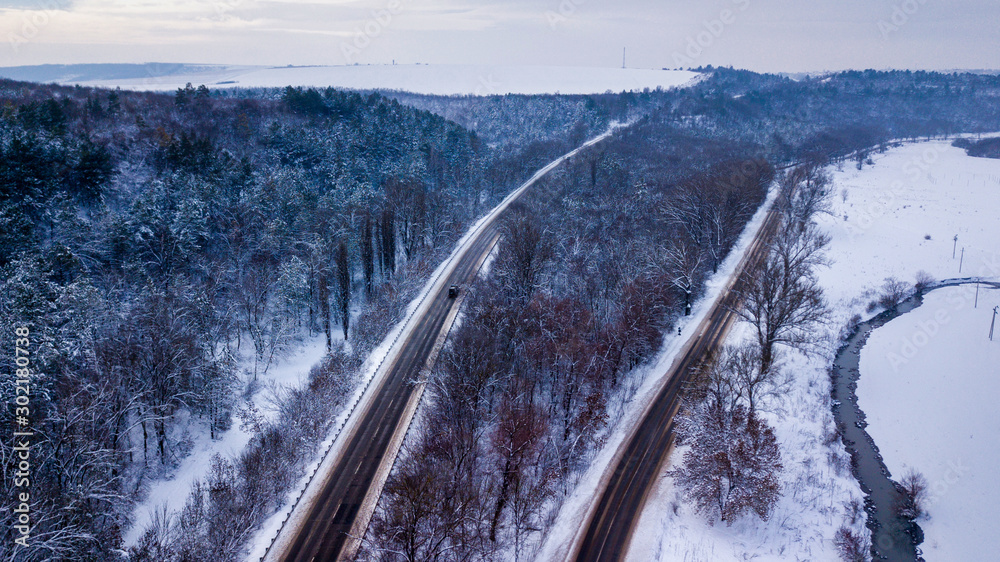 Aerial or top view from a drone on a highway in winter weather