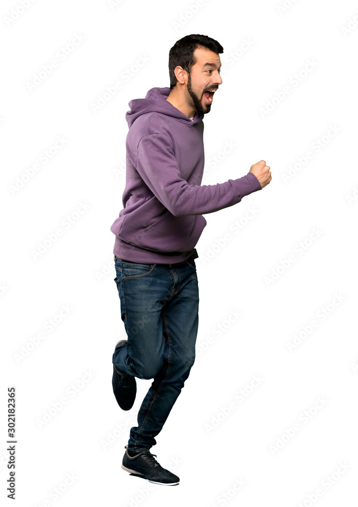 Handsome man with sweatshirt running fast Handsome man with sweatshirt running fast