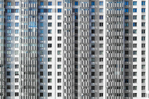 new apartment building, thousands of windows, sleeping area.