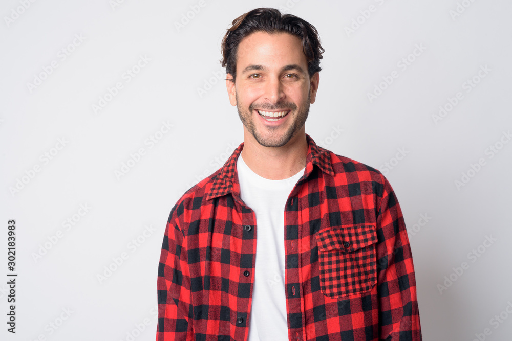 Face of happy Hispanic hipster man smiling Face of happy Hispanic hipster man smiling