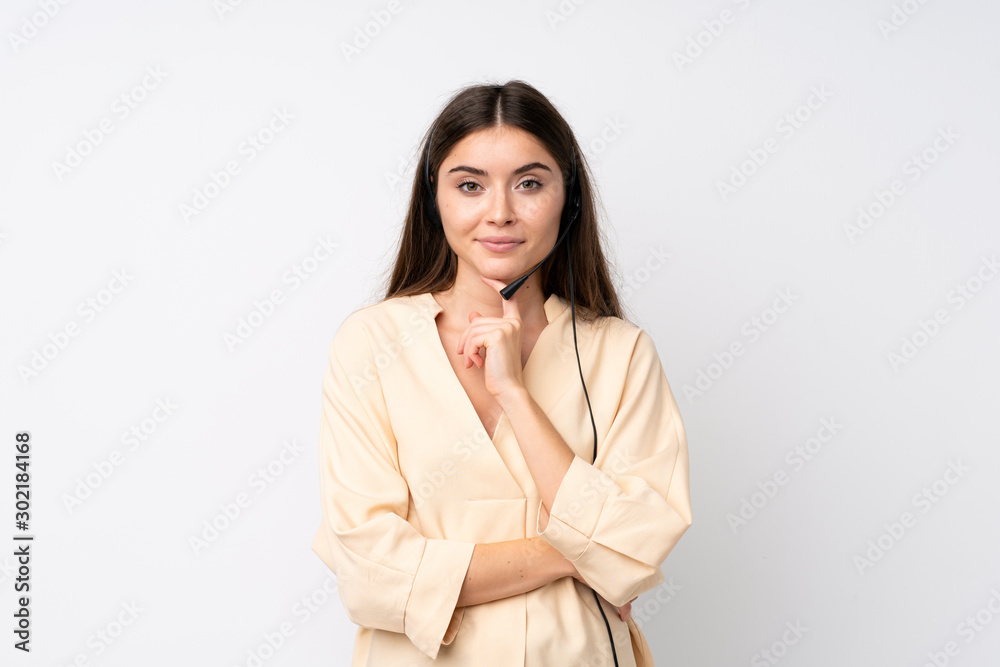 Young telemarketer woman over isolated white background laughing Young telemarketer woman over isolated white background laughing