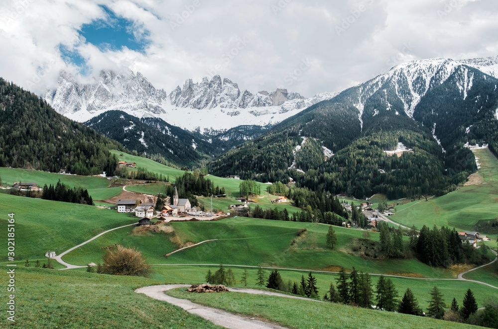 Santa Maddalena village with Dolomites mountains in background.