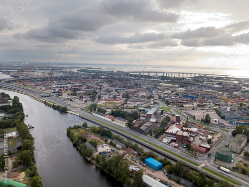 Drone view of the industrial part of St. Petersburg, Kanonersky island with Western high-speed diameter and the Gulf of Finland on the horizon © Konstantin Kulikov
